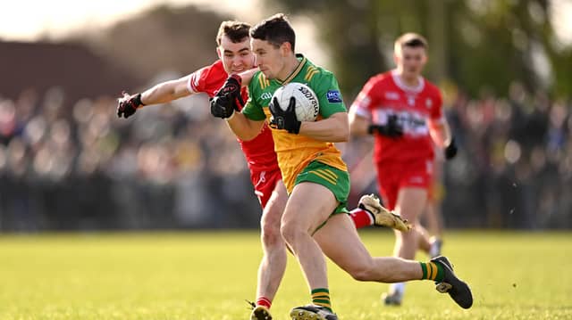 Eoin McHugh of Donegal in action against Derry's Diarmuid Baker