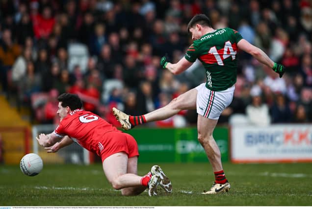 Frank Irwin of Mayo has a shot on goal blocked by Padraig McGrogan of Derry. Pic by Ben McShane/ Sportsfile