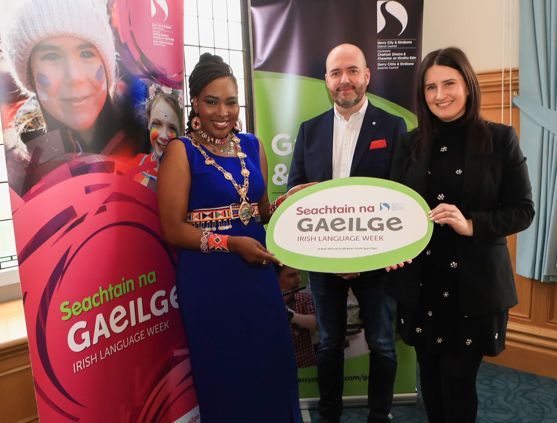 The Mayor of Derry City and Strabane District Council, Cllr Lilian Seenoi Barr with Erin Hamilton and Pól Ó Frighil from Council's Irish Language Team at the launch of Seachtain na Gaeilge.