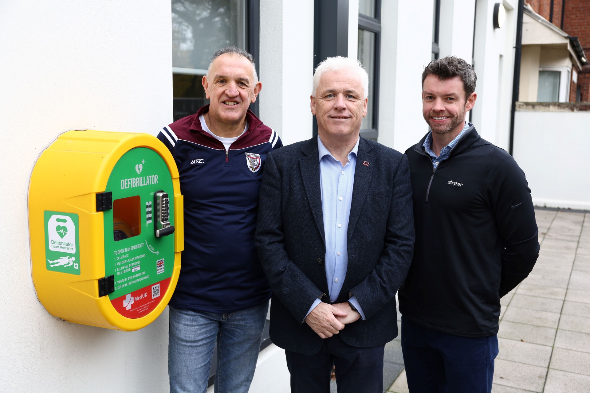 John Deery and Peter O'Hare are pictured alongside Head of British Heart Foundation NI’s Fearghal McKinney.
