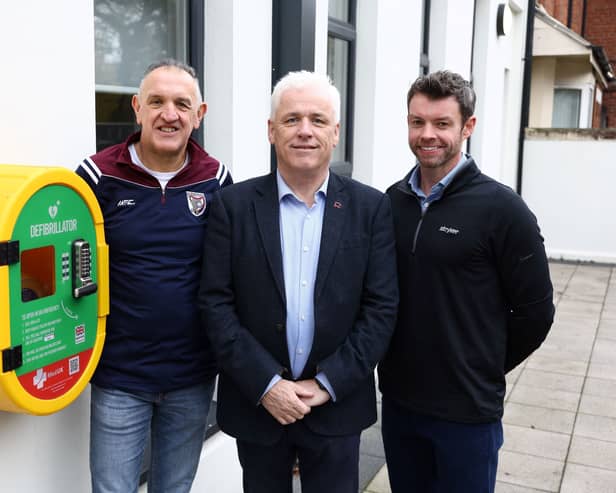 John Deery and Peter O'Hare are pictured alongside Head of British Heart Foundation NI’s Fearghal McKinney.