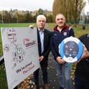 John Deery (centre) from Eglinton survived a cardiac arrest at this year’s Belfast Marathon thanks to a life-saving defibrillator and CPR performed by Peter O’Hare (right holding the defib)