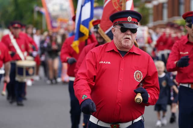 Orangemen parade passes by Ardoyne without incident as residents stage ...
