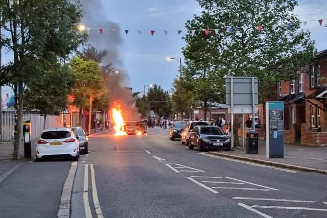 During violence earlier in the day, businesses were attacked after an anti-immigration protest moved through the city.