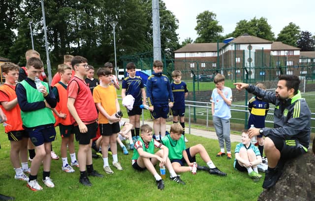 Senior Soccer Academy Manager at Celtic Football Club, Jose Romero talks to players from Don Boscos. Pic by Tom Heaney, nwpresspics