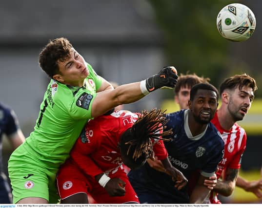 Ed McGinty punches the ball clear under pressure. Pic by Harry Murphy/ Sportsfile