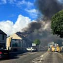 Thick smoke billowing out of the former nightclub yesterday evening.  Photo: Chris Arthur/McAuley Multimedia