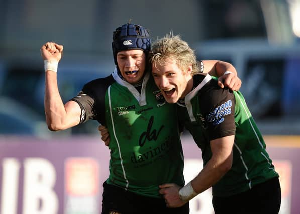 Richard McCarter celebrates scoring a try with team mate Rudi Moore in the 2010 Junior Cup final against Armagh. (Photo: Stephen McCarthy/Sportsfile)
