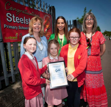 Mrs Siobhan Gillen, Principal, Miss Bronagh Lynch, teacher and Mrs Sarah Brown, Classroom Assistant pictured with members of the Eco Committee: Farrah, Elsa and Maya.