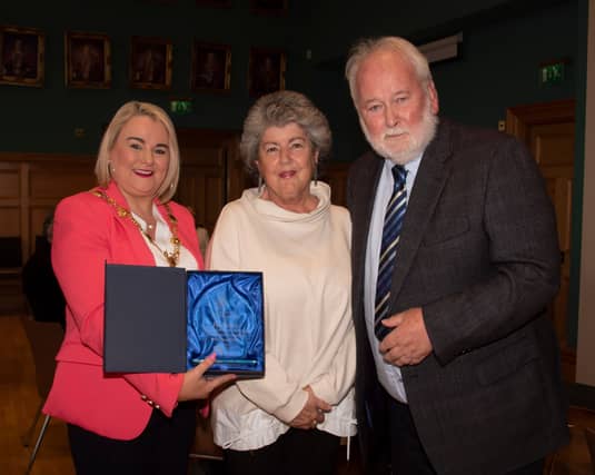 Mayor Sandra Duffy making a presentation to former Derry Journal editor Pat McArt at the Guildhall. Centre is Pat’s wife Rosie.