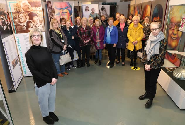 Amanda Biega, Good Relations officer, DCSDC, with Bernadette Walsh, Museum Curator, with a group on a tour of the ‘Peace Heroines Exhibition’ to mark Good Relations International Women’s Day.