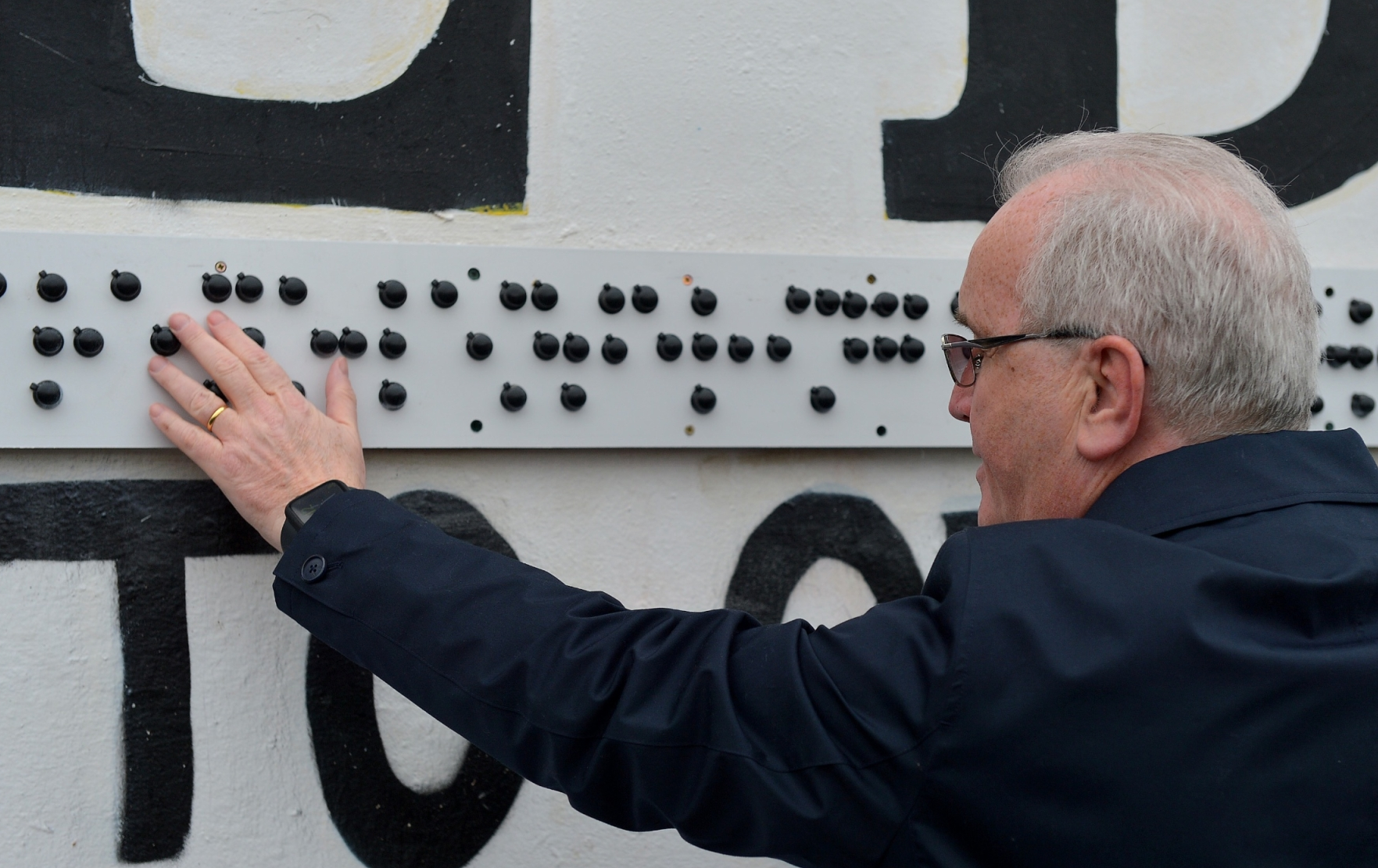 Mr Moore said that the braille translation of “You Are Now Entering Free Derry,” was part of the “Wall for All” campaign