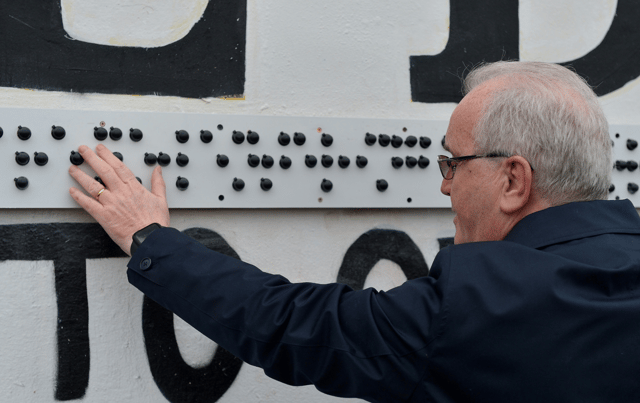 Mr Moore said that the braille translation of “You Are Now Entering Free Derry,” was part of the “Wall for All” campaign