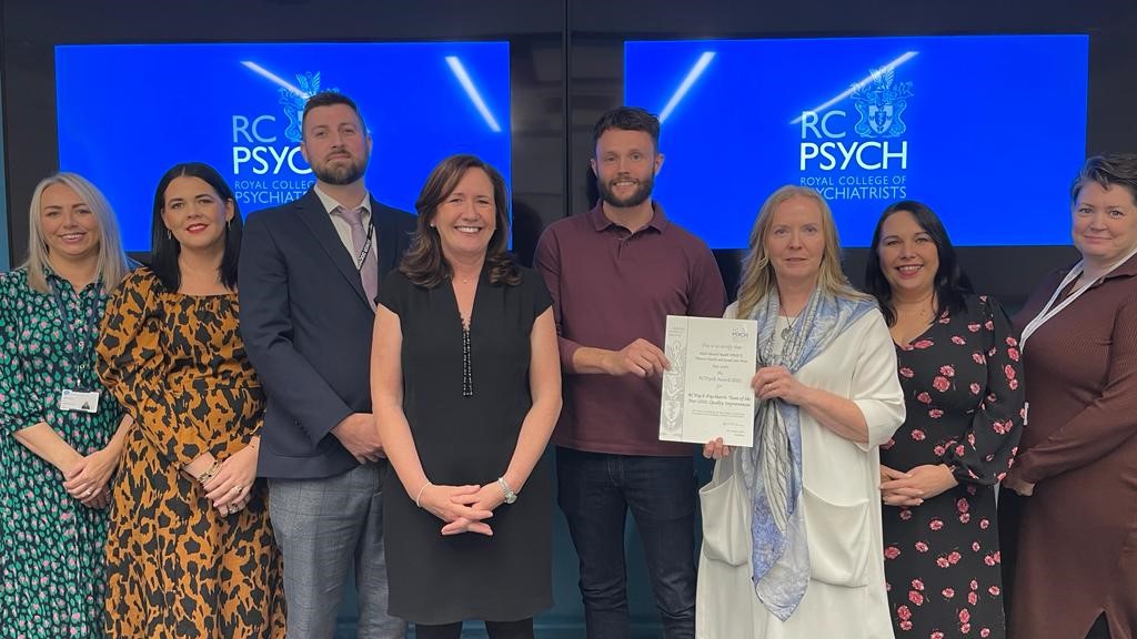 Western Trust Mental Health team led by Dr Chris Sharkey, Consultant Psychiatrist, collect their award.