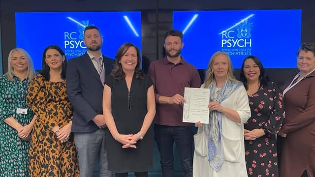 Western Trust Mental Health team led by Dr Chris Sharkey, Consultant Psychiatrist, collect their award.