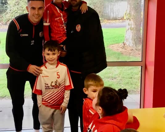 "The players brought signed posters and t-shirts with them to give to the school.