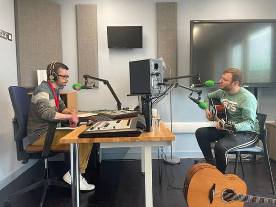 Maghera musician Jack Warnock (right) in Raidió Fáilte's Belfast studio.
