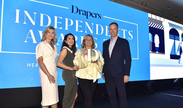 The team from the Re:Imagine Pop Initiative receiving the Drapers Independent Community Champion Award for 2022 at Grosvenor House, London.