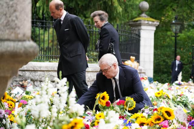 The Duke of York put his arm around his daughter Princess Eugenie as she wiped a tear from her cheek while reading tributes to her grandmother at Balmoral – the first time the members of the royal family had been seen together in public since the Queen’s death on Thursday.