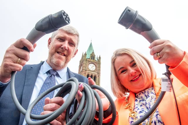 Infrastructure Minister John O’Dowd and Mayor of Derry and Strabane District Council Sandra Duffy welcoming a funding boost for electric vehicle charge-points in residential areas across the north