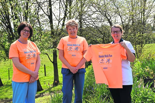 Dr. Rachael Coulter, speciality doctor in palliative medicine, Pamela Coyle, clinical ward sister and student nurse Geraldine Nash with the 2022 Foyle Hospice Female Walk T-shirts.