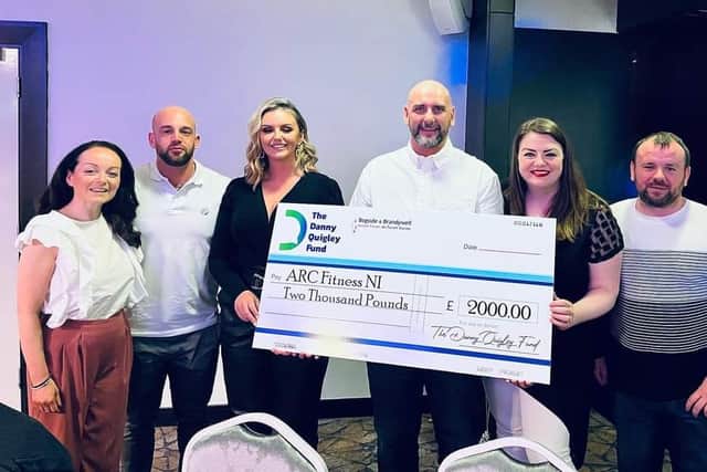 Founder of ARC Fitness, Gary Rutherford, and Manager at Belmont Cottages, Seamus Crossan, thanked Danny for the donations and described him as a "legend" and a "true hero."