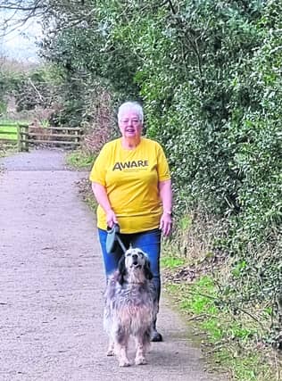 ABOVE - Evelyn walking in the Roe Valley Country Park with her dog Lily.