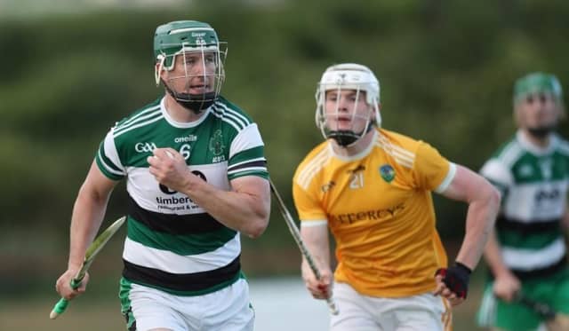 Breandán Quigley looks for options in an Antrim league game against Cúchullain's Armagh.