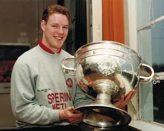 Dermot Heaney takes the Sam Maguire Cup back to Anahorish PS in 1993