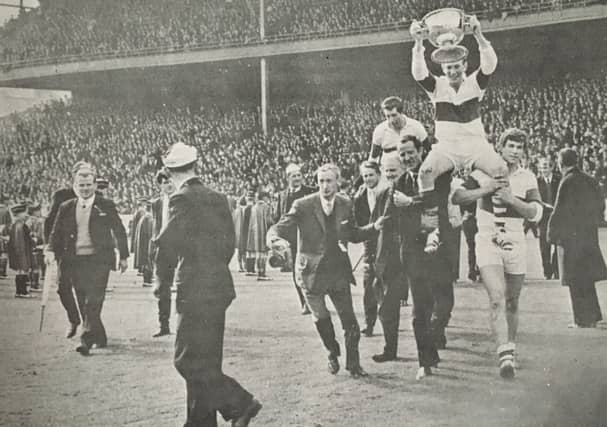Tommy Diamond is carried shoulder high in Croke Park with the Tom Markham Cup in 1965