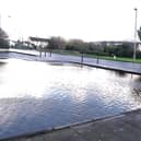 The car park outside the Buttercup Cafe is flooded.