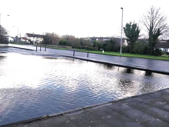 The car park outside the Buttercup Cafe is flooded.
