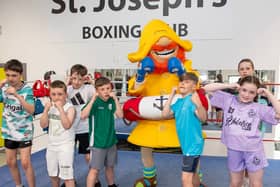 Young boxers at St Joseph's ABC in Derry ready for action alongside Fisherman Rod from CompareNI.