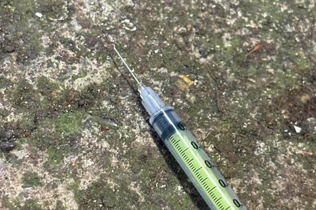 A used needle which was discarded.