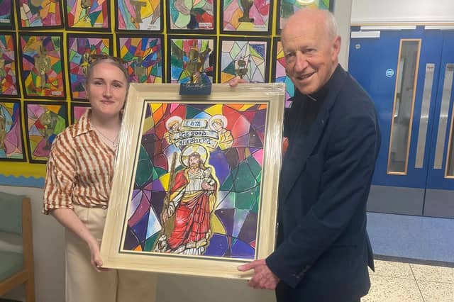 Monsignor McCanny receives a canvas of the Good Shepherd stained glass window in St. Mary’s Church from local artist Shauna McAteer who was commissioned to create the piece by Termoncanice Primary School.