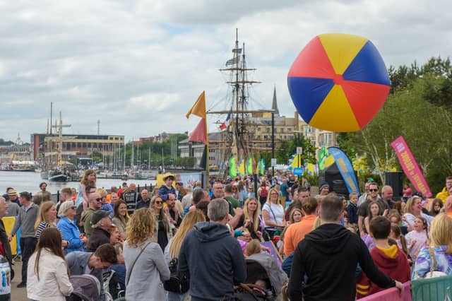 A giant beach ball rises over the crowd during a game of 'keepy uppy', at Derry City and Strabane District Council's Foyle Maritime Festival in 2024.