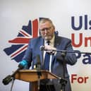 Doug Beattie in front of an UUP poster