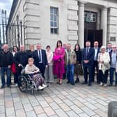 Mr John McDevitt, his mother Agnes, sister Elaine and life partner Willie with Colum Eastwood MP,  Cllr Brian Tierney, Grainne Teggart from Amnesty International, Des Clayton from Pat Finucane Centre, representatives from Cúnamh and Patricia Coyle, solicitor. Representatives from other NGOs who assisted in the case were also in court today from Committee for Administration of Justice and Mark Thompson from Relatives for Justice. 