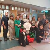 St Joseph's Uisce For Gaza coffee morning: Cllr Brian Tierney, Colum Eastwood (Foyle MP), Siobhain Grogan (Uisce For Gaza), Annmarie Meehan & Gerry mcBride (teachers), Cllrs Aisling Hutton, Patricia Logue & Pat Murphy, Marie-Therese Newton (teacher), Ciara Deane (Principal) with St Joseph's students.