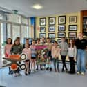 Pictured celebrating the achievement are Orlaith Quinn (NIRN) alongside students who attend the local Cornstore Youth Club, who heavily supported the eco-friendly initiative.