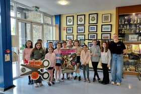 Pictured celebrating the achievement are Orlaith Quinn (NIRN) alongside students who attend the local Cornstore Youth Club, who heavily supported the eco-friendly initiative.