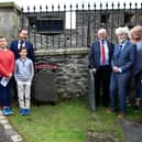 Descendants at the grave of their forefather, William Scott (1765-1858) - Father of the Derry Shirt Industry after the unveiling of the memorial in the grounds of St Columb's Cathedral on Sunday. 