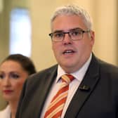DUP leader Gavin Robinson speaking to members of the media,