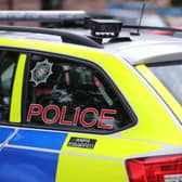 A PSNI badge on a vehicle