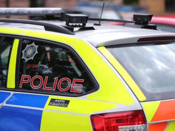 A PSNI badge on a vehicle