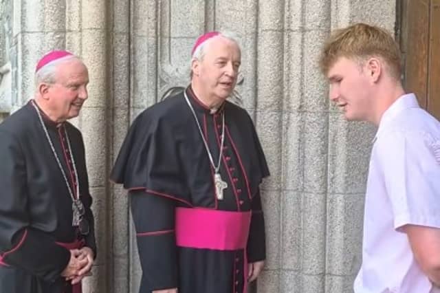 Bishop Dónal McKeown and Bishop Michael Router greeting parishoners at St Eugene's Cathedral on Thursday morning.