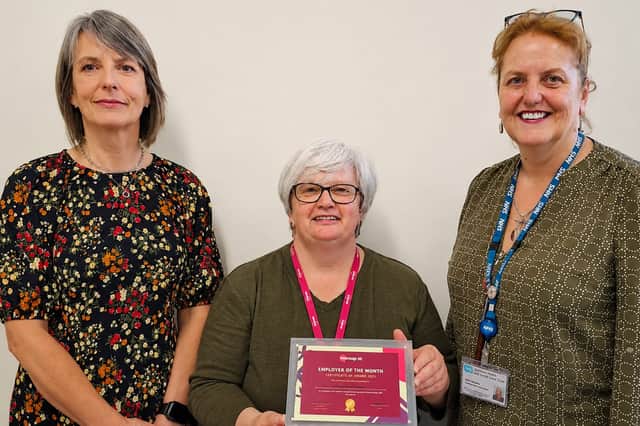 Jane Martin (centre) from Mencap presents the Employer of the Month award to Ann O’Neill (left) and Linda Saunders (right) from the Northern Health and Social Care Trust.