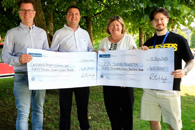 Former Mayor of Derry and Strabane Councillor Ruairí McHugh handing over cheques totallying £81,580 to each of his chosen charities during his mayoral year. On left, Dr. Declan Gallagher, Castlederg Patient and Comfort Care and on right, Liz Graham and Shea Doherty, PIPS Suicide Prevention.