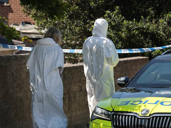 Forensic officers at the scene