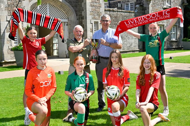 Councillor Henry Cushinan, Mayor of Antrim and Newtownabbey, and William Campbell, Director of the Budget Energy SuperCupNI, are pictured at the picturesque Clotworthy House in Antrim Castle Gardens with Crusaders players Kelly Robinson and Lily Steen, Glentoran players Eloise McAuley and Riah Totten, Amelia Fleming (Linfield) and Ria Conere (Cliftonville) ahead of the 2026 Budget Energy SuperCupNI Girls' Tournament.